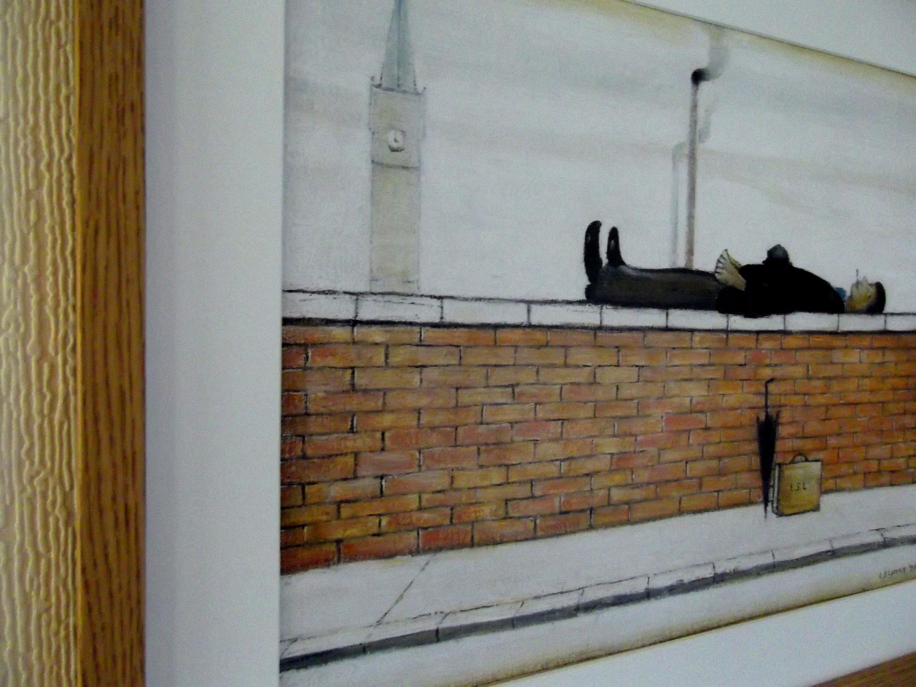 L S Lowry Print – Man Lying on Wall - Oak Finish Frame with Mount and Textured Image